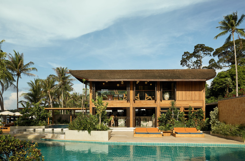 Addressing the building’s formerly enclosed nature, generous new openings were carved out to blur boundaries with sea views, improve access from both pools, and connect the two restaurant levels. - Pichan Sujaritsatit