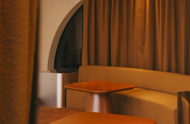 Textiles in specific shades – terracotta, burgundy, blue and green – define various zones, and moveable curtains allow employees to tweak the space as needs change from day to day. - Pablo Algaza
