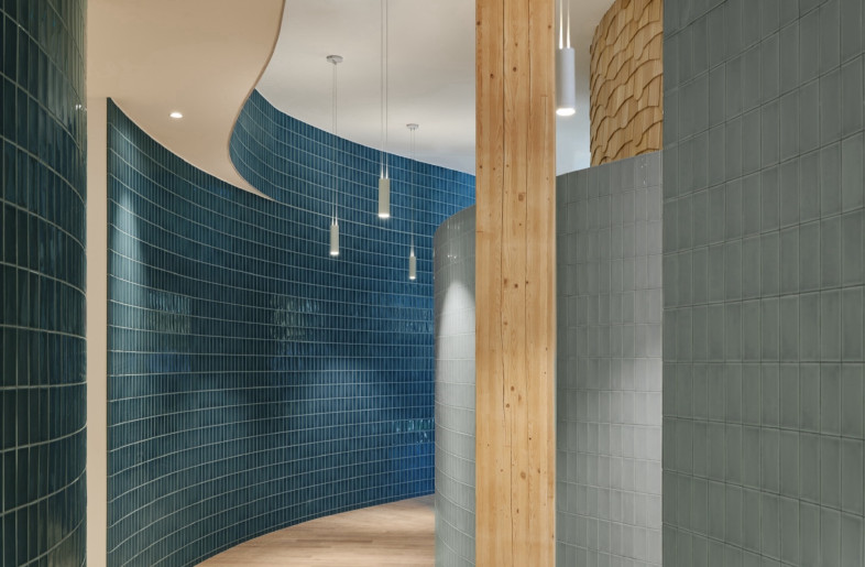 Its walls are soft and curved, suggesting a meandering stream, leading residents naturally through intake, counselling and community spaces. - Doublespace