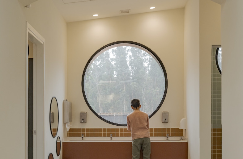 Windows are abundant, flooding the space with natural light and further establishing the connection to the terrain beyond. - Eleazar Cuadros