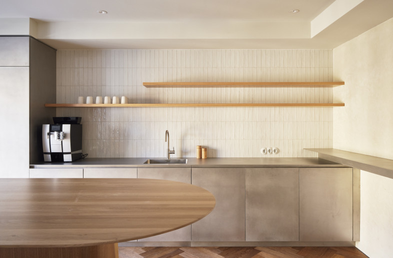 View into the kitchen made of hot-rolled stainless steel handmade by a carpenter. - Elias Hassos