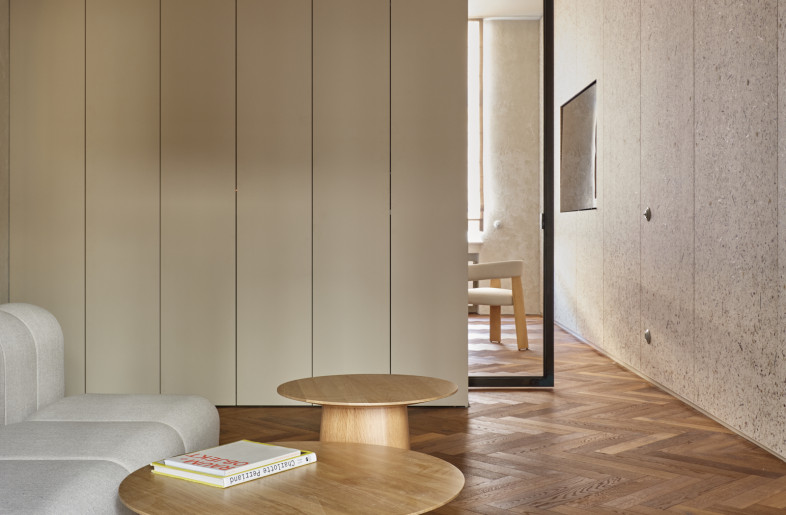 View into the lounge of the natural grass wallpaper facing the light. - Elias Hassos