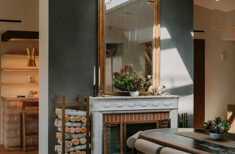 Custom multipurpose table designed by HUXHUX Design Inc in front of original fireplace - Teal Thomsen