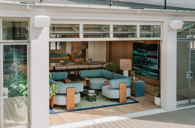 View from outdoor rooftop gazebo into central gathering space on main level. - Teal Thomsen