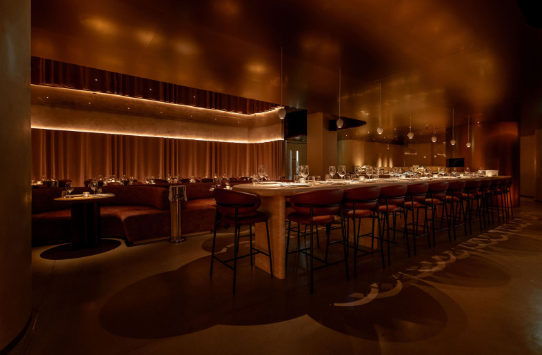 Set to the left of the staircase, the dining area is ‘marked’ in stone by a communal table line. - STEVIE CAMPBELL CREATIVE