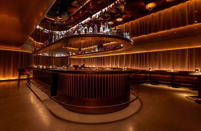 The bar-lounge serves as the focal point at the foot of the staircase. - STEVIE CAMPBELL CREATIVE