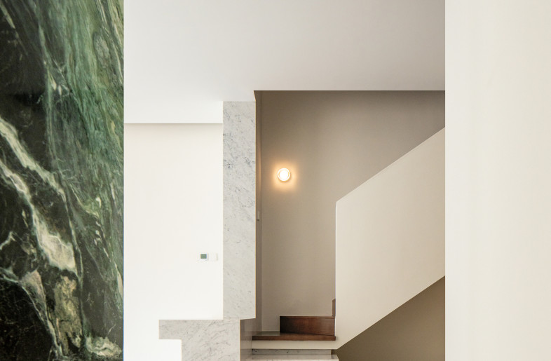 staircase in groundfloor, together with the dining island folding into a monolithic base - Ziling Wang