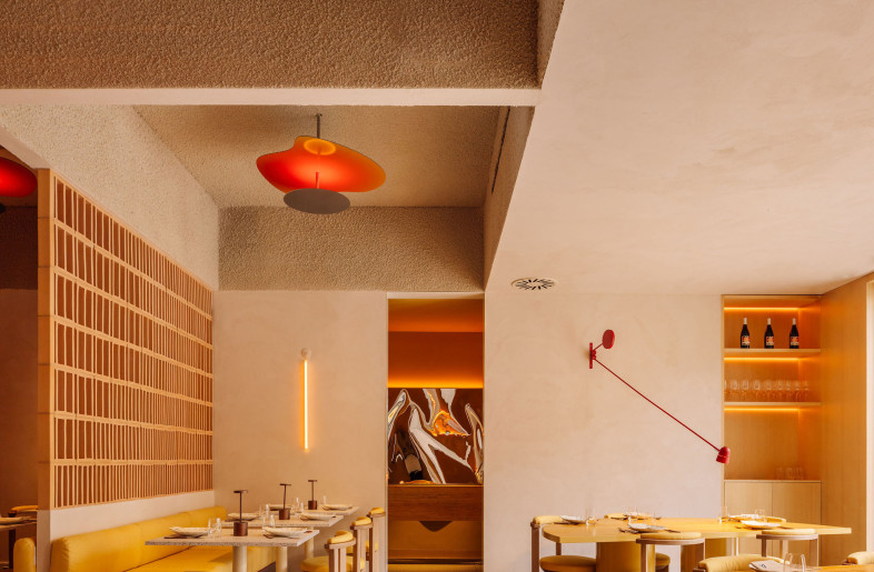A spatial rhythm defined by repetition, circular geometries, and a warm, tactile palette. Every element—down to the custom furniture—reinforces the room’s sense of cohesion and softness. - Francisco Nogueira