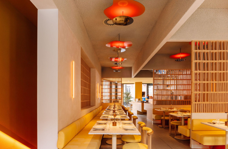 A modular dining axis integrates custom bench seating, vertical screens, and lighting into a cohesive spatial system. Each element is site-specific yet repeatable, balancing rhythm, privacy, and flow. - Francisco Nogueira