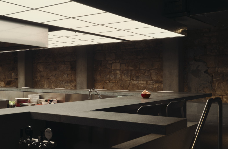 The kitchen is designed as the central focal point of this restaurant. - David Chatfield