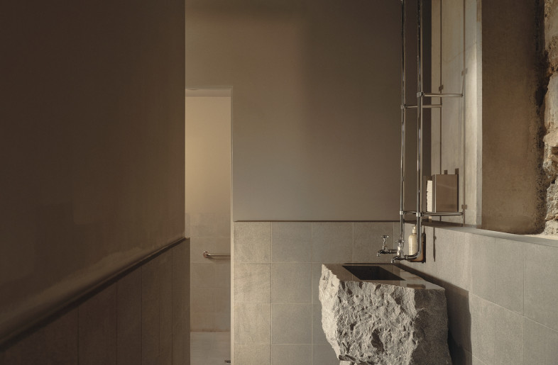 Raw stone and polished granite are used throughout the venue. - David Chatfield