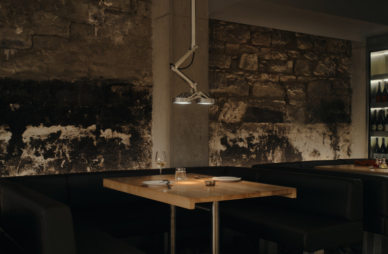 Away from the kitchen, lighting is sparse save focussed spotlights on the diners. - David Chatfield
