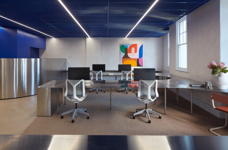 In parts of the office the deep blue is also used in the mesh ceiling. - Luc Remond