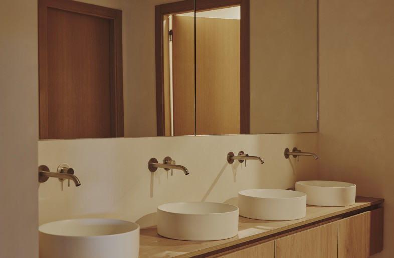 Natural finishes bring calm to the concrete-dominated space. - David Zarzoso