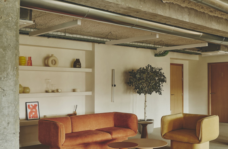 Rounded furniture in sunny colours contrast well with the industrial-looking exposed ceilings. - David Zarzoso