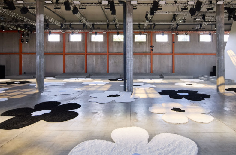 For SS26, Deposito at Fondazione Prada, the usual home of Prada’s fashion shows, was freed entirely of all previous set designs. - Courtesy of Prada