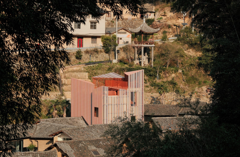 Rather than camouflaging the building's juxtaposition against Songzhuang Village's traditional rammed-earth houses, the architects amplify the contrast deliberately. - Jonathan Leijonhufvud