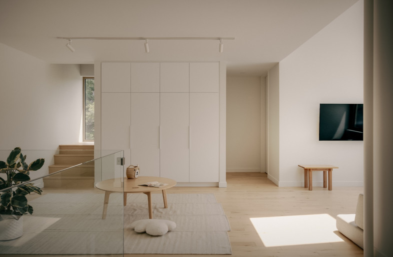 Built-in furniture designed by Appareil Architecture, from entry storage integrated into the staircase to a custom headboard in the primary suite, grounds the space further. - Felix Michaud