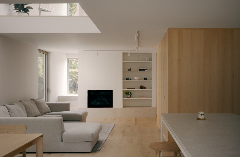 The material strategy continues inside through custom millwork: storage is accessible but subtle. - Felix Michaud