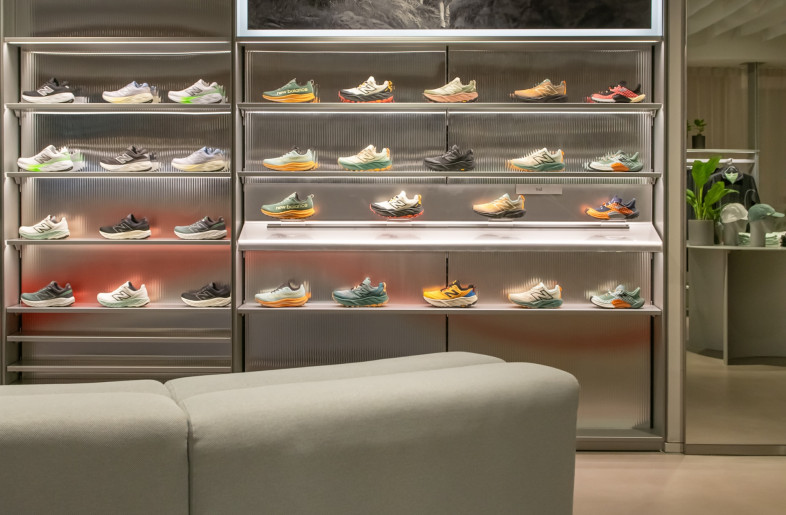 The studio used the grey and red of the brand colours throughout the store. - Courtesy of Universal Design Studio