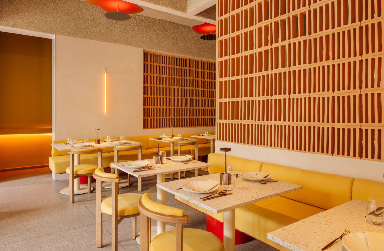 Inside the main space, soft warm colours and natural finishes like woodgrain and terracotta create a sunny, relaxed atmosphere, setting the stage for maximum meal enjoyment. - Francisco Nogueira