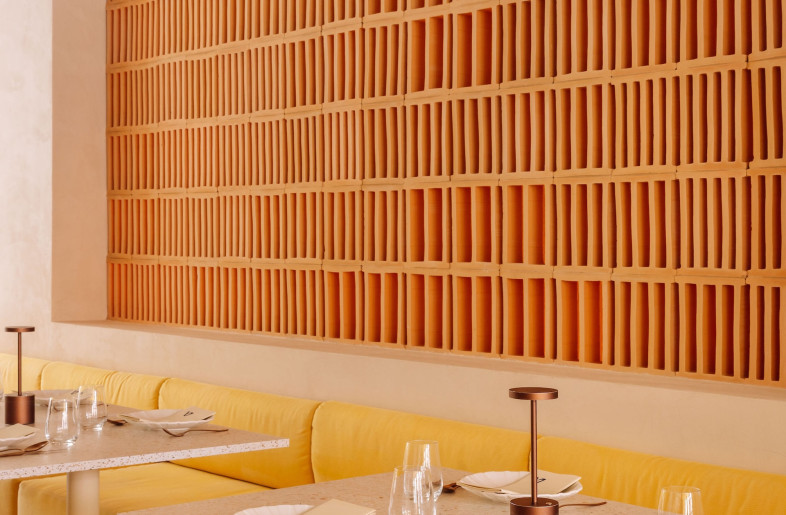Terracotta breezeblocks in the main dining room bring warmth and texture into the space. - Francisco Nogueira