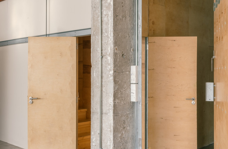 As both living and working need to take place in the large, light-flooded former warehouse, closed, birch-clad volumes create visual separation and provide noise buffering. - Simone Marcolin