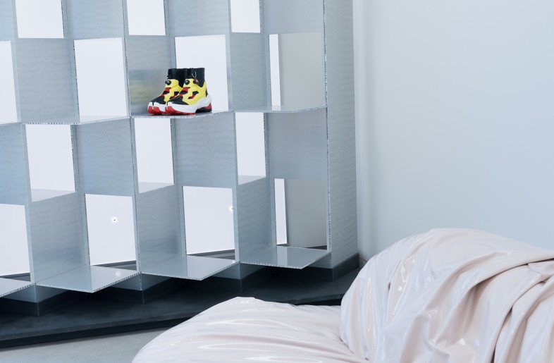 ardboard sprayed a subtle chrome are configured in a checkerboard shelf ideally suited to product display. - Gian Barbarona