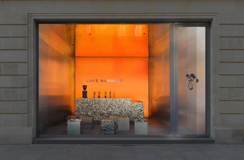 Situated facing the Jardins des Archives Nationales, Crosby Studios' design for a takeaway café glows in vibrant orange tones that shift in intensity throughout the day. - Courtesy of Crosby Studios