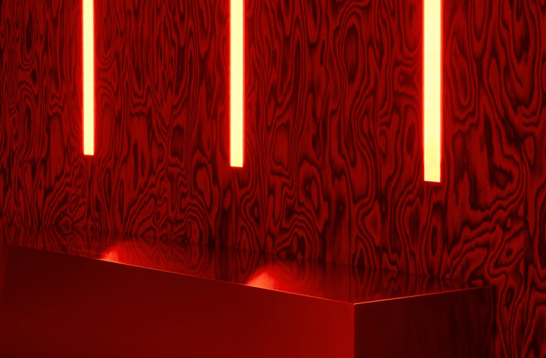 Vertical lights along the walls illuminate partygoers from the side and a small area for seating creates a much-needed spot to rest tired feet in between bouts of dancing. - Simone Marcoli