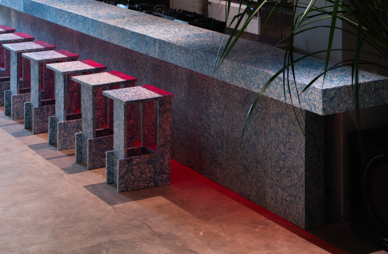 A blue-and-white marbled composite bar serves as a place for SCCC-goers to rest and commune. - Ernest Theofilus