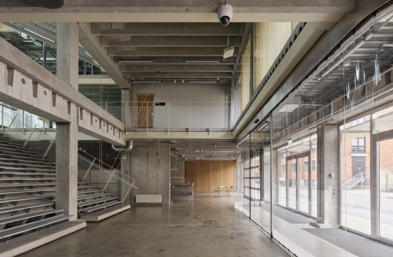 Users are greeted by a broad bleacher-like staircase that bridges the ground and first floors – a structural solution that ‘weaves the floors together, creating spatial variation and shifting vertical thresholds’. - Hampus Berndtson