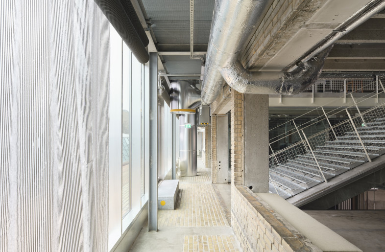 Stripping the structure back to its concrete frame – TT-slabs, beams and horizontal window bands – the architects worked almost entirely within its original material palette. - Hampus Berndtson