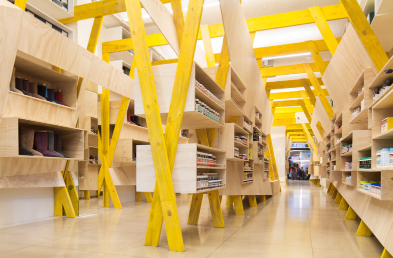 Frameweb | Tandem's timber display embraces Hugg store interior