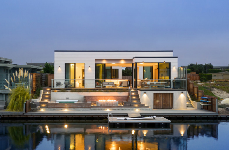 View from the lagoon. The lower deck and floating dock, firepit and jacuzzi. - Paul Dyer
