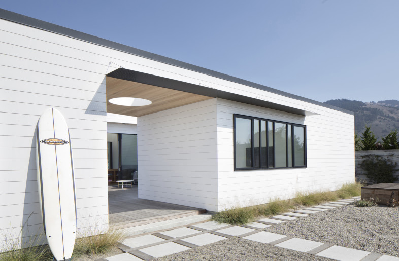 From the street, the breezeway establishes a sense of entry to the three sided courtyard. - Paul Dyer