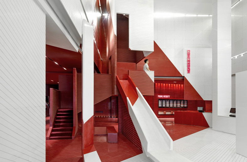 The most striking visual effect in the lobby is the contrast between red and white colours. There seems to be an invisible light wall in the space. - Jonathan Leijonhufvud Architectural Photography