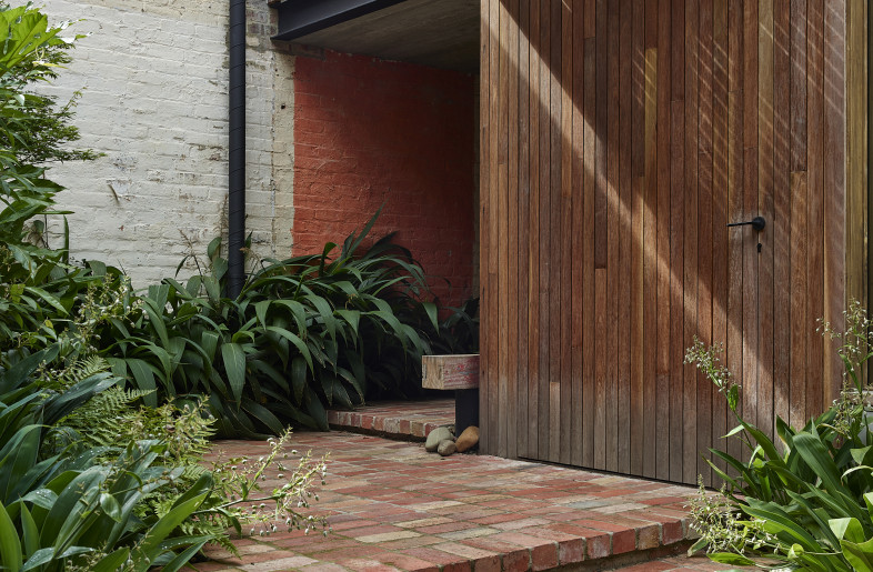 The entry journey through a recycled brick paved garden. - Derek Swalwell