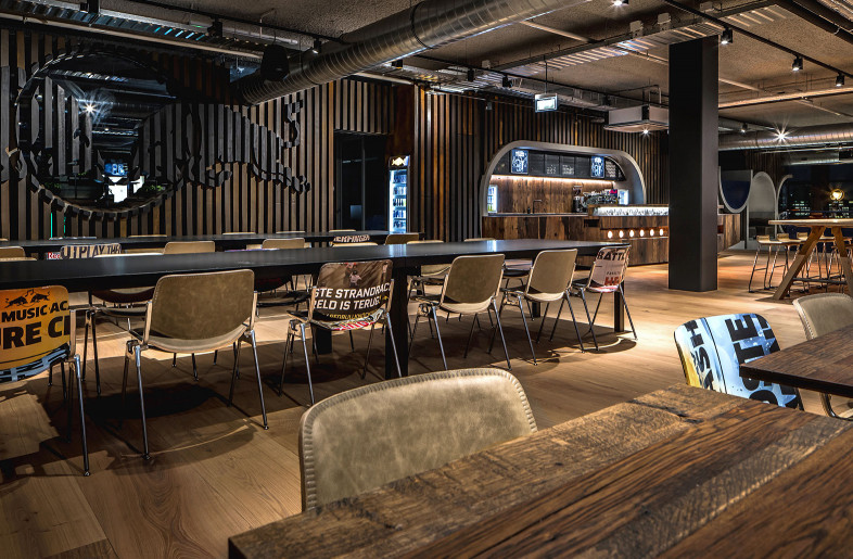 The cafe area is more off a grand cafe/ skihut than an office place - Peter Baas Photography