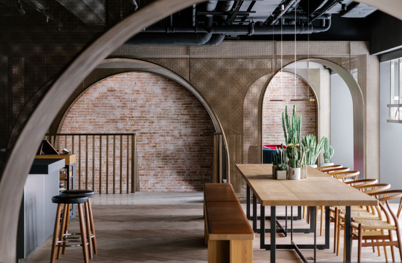 A series of arches define the space in the House of Madison, Hong Kong. - Photograph by Lit Ma