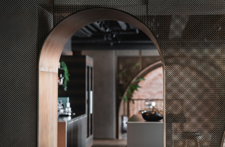 Bronze arches are carved in different widths to give a unique play on light and shadow through semi-transparent layers. - Photograph by Kevin Mak