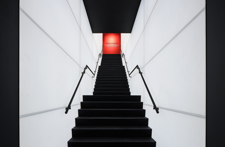 A striking staircase connects the first and second floor, becoming a powerful representation of the past, present, and future of our practice, and culminating with the company motto “Design Has The Power To Break Boundaries" engraved in the red feature wall. - Mr. Sun Jun