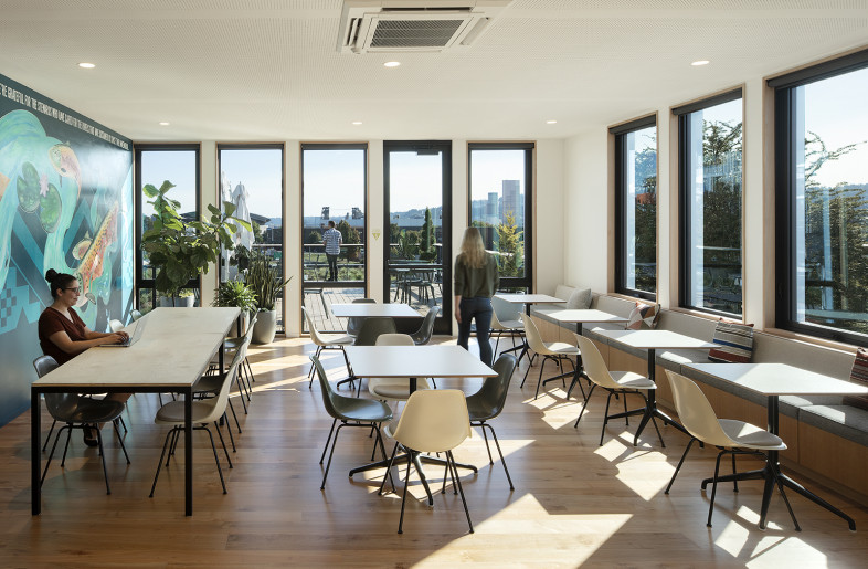 Lunchroom and roof garden terrace featuring custom mural “Kapasháayat Tkwalá” by artist Toma Villa - Jeremy Bittermann