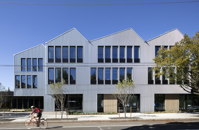Custom metal panels on the façade create a dramatic play of natural light - Jeremy Bittermann