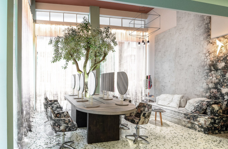 view from the entrance, the whole salon area is visible. The curtains, chair and sofa fabric are all custom-printed with a cohesive visual pattern. - vasilislagios photographer