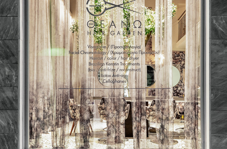 View from the exterior. The window is designed in such a way that it attracts the eye to the olive tree inside. - vasilislagios photographer