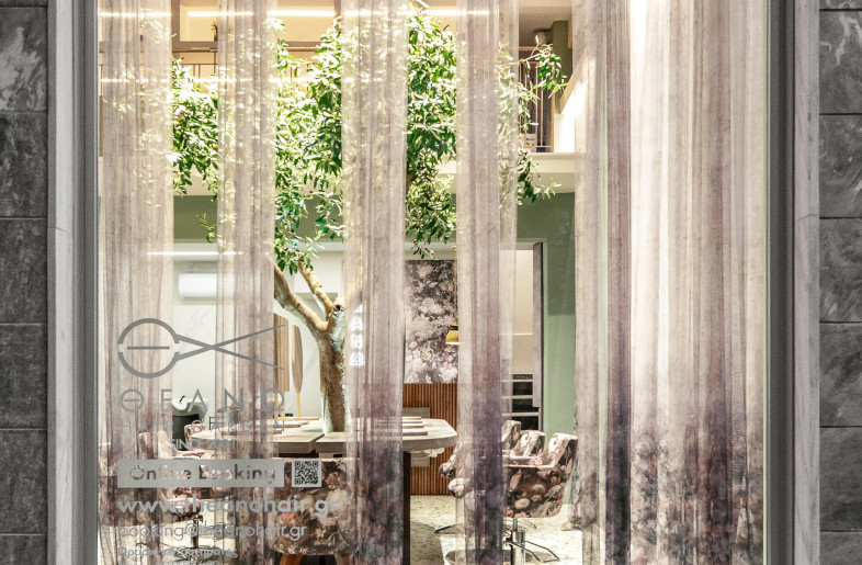 View from the exterior. The window is designed in such a way that it attracts the eye to the olive tree inside. - vasilislagios photographer