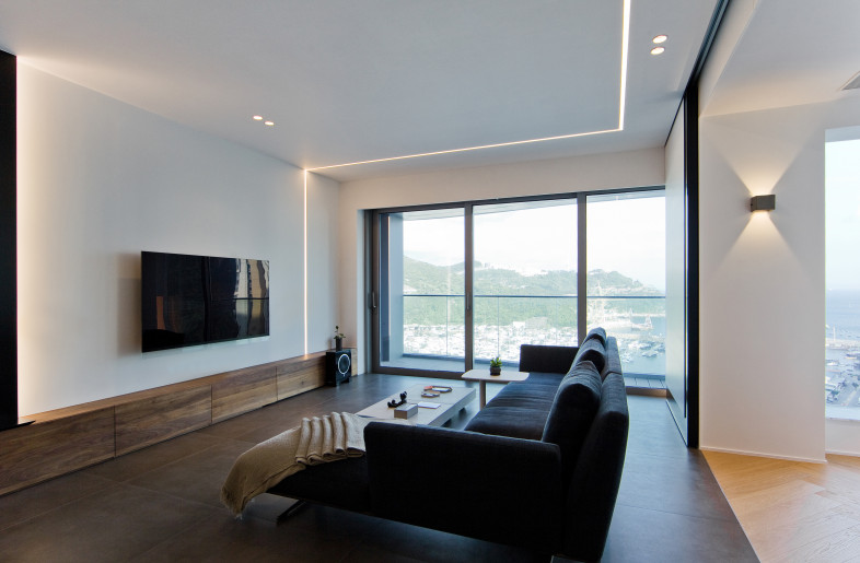 Our designer placed the light beams on the wall in different forms which has highlighted the feature wall with an accent, and brought a vibrant rhythm to the living space. - N/A