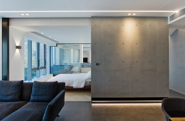 A sliding door separates the living room from the master bedroom, when it is just the two of them at home, the owners can open the doors and the entire space from living room to bedroom, can be open. - N/A