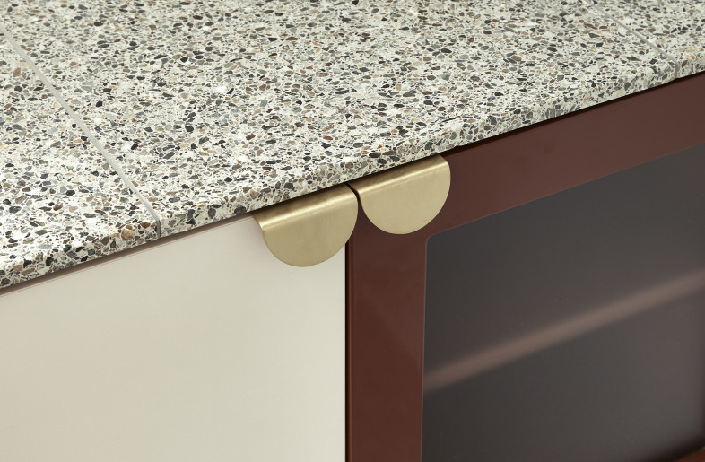 Terrazzo floors and countertops in the bathrooms give a nod to mid-century modern design. - Photography: Damian Bennett